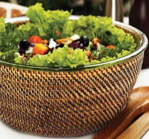 Glass salad bowl with woven rattan holder